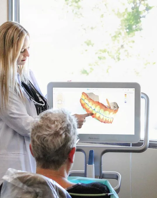 Olympia dentist Dr. Evans providing patient with care