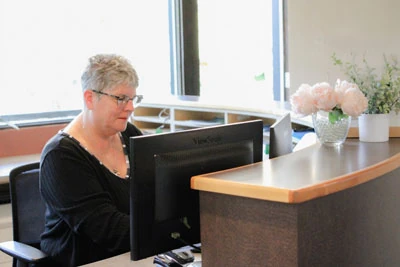 Teresa scheduling a patient's dental care at Capitol Lake Dentistry
