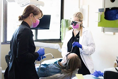 Dr. Evans and staff performing emegency dental care in Olympia, WA
