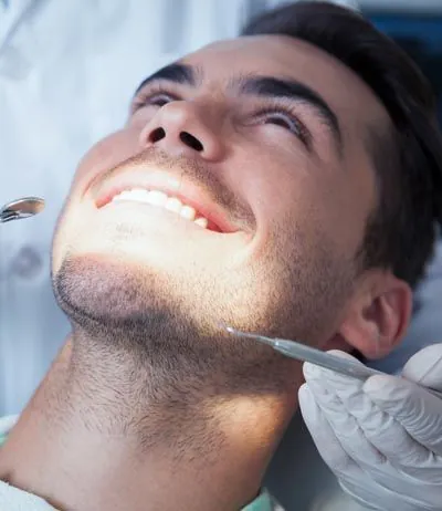 man getting dental treatment at Capitol Lake Dentistry